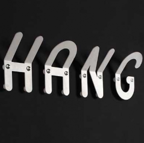 Wall hooks spell out the word :HANG"