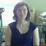 video conference view of woman in messy home office