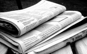 B & W photo stack of newspapers