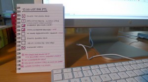 photo of computer keyboard and screen with handwritten to-do list