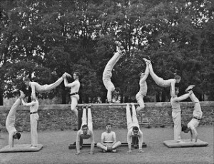 old photo (1920's of men doing gymnastic poses.