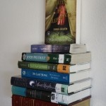 umbra's invisible book shelf Books in a stack appear attached to the wall