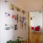 Ikea dignitet curtain hanging system used to display artwork