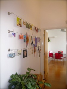 Ikea dignitet curtain hanging system used to display artwork