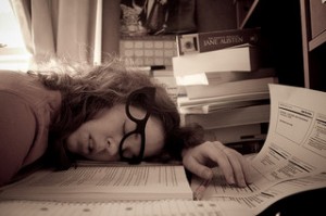 woman slumped on desk, asleep