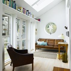 Beyond the home office: Book shelf over window  in family room.